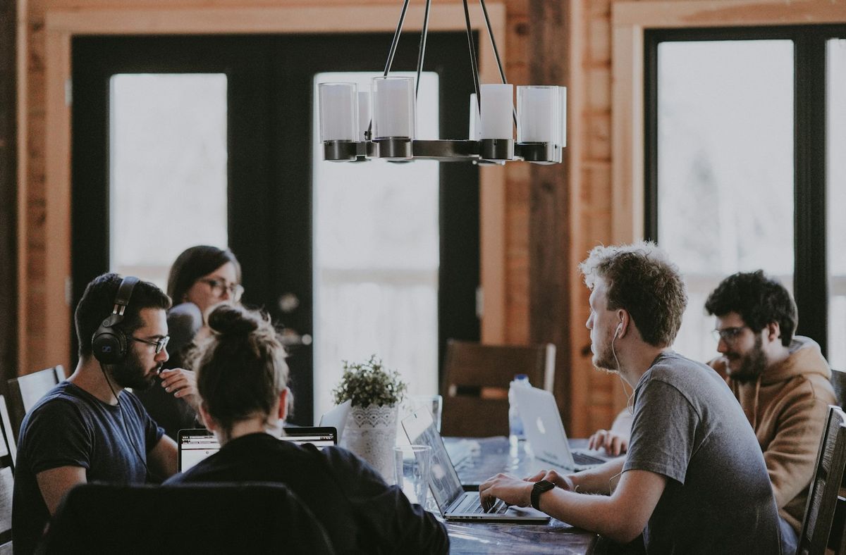 A founder and leadership team working the plan at the table